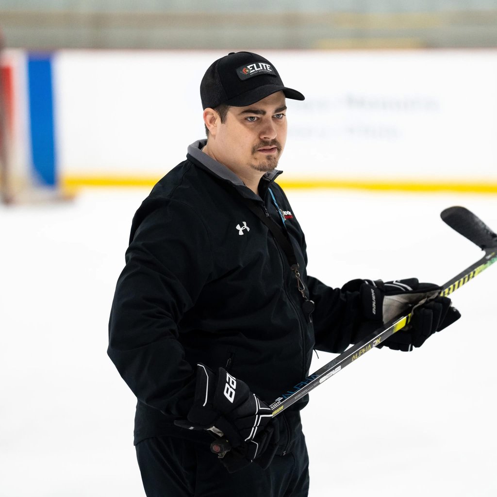 Coach Jake Bullen on the ice